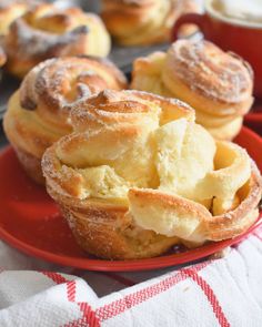 several pastries are sitting on a red plate