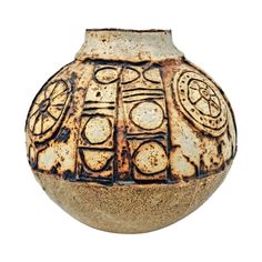 a brown vase with designs on it