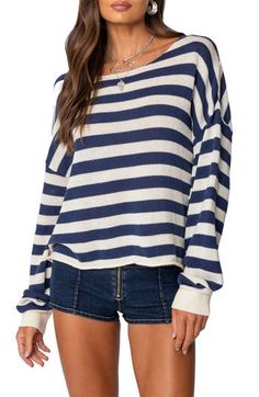 Lightweight  and relaxed, this sweater ringed in bold stripes sports a dramatically oversized fit that slouches like an old favorite. Boat neck Long sleeves with ribbed cuffs 90% cotton, 10% polyester Machine wash, dry flat Imported Casual Blue Sweater With Contrast Stripes, Casual Oversized Top With Striped Cuffs, Oversized Striped Cotton Sweater, Navy Casual Sweater With Contrast Stripes, Casual Sweater With Contrast Stripes And Relaxed Fit, Casual Sweater With Striped Sleeves And Crew Neck, Casual Oversized Sweater With Striped Sleeves, Casual Relaxed Fit Top With Striped Cuffs, Casual Striped Sweater