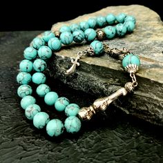 "This handmade gemstone tasbeeh; It is also known by different names such as misbaha, prayer beads, rosary, chapelet, dhikr beads, misbah, sibha, stress beads. This islamic tasbih is a great muslim gift idea. All beads are turquoise gemstone. The known proferties of natural turquoise stone are: -It keeps bones healty -It is beneficial for migraine and reduces cough -It regulates blood circulation and blood pressure. Tassel material is stainless metal. PRODUCT DETAILS Weight: 55gr Grain Shape: Ro Natural Turquoise Stone, Islamic Prayer, Wooden Gift Boxes, Natural Turquoise, Migraine, Prayer Beads, Turquoise Gemstone, Turquoise Stone, Rosary