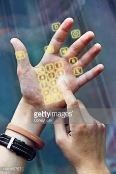 two hands reaching up towards each other with yellow symbols on their palms and fingers in front of them