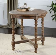 a wooden table sitting on top of a white rug