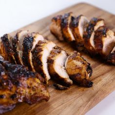 sliced chicken on a wooden cutting board