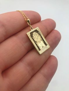 Elevate your style with our exquisite 14K Solid Gold Tarot Necklace featuring The Hierophant card, a symbol of spiritual guidance and wisdom. This celestial women's necklace not only adds a touch of mystique to your look but also serves as a powerful piece of spiritual jewelry. Crafted with meticulous attention to detail, this Gothic-inspired necklace is a unique and thoughtful gift for her, perfect for those who appreciate the profound symbolism of tarot cards. Embrace the mystical allure of Th Spiritual Rectangular Jewelry For Good Luck, Rectangular Spiritual Jewelry For Good Luck, Spiritual Rectangular Good Luck Jewelry, Rectangular Spiritual Good Luck Jewelry, Tarot Necklace, Spiritual Necklace, Card Necklace, The Hierophant, Women's Necklace