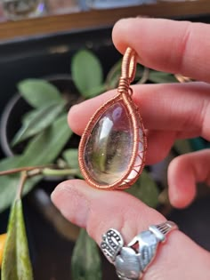 This lovely ametrine cabochon is wire wrapped by me using copper wire, it is very light in color almost clear.  Will come on a black necklace cord  Due to the copper wire being bare wire it may tarnish over time. Wire Wrapped Sphere, Copper Wire Necklace, Copper Wire Wrapped Jewelry, Wire Wrapped Faceted Gemstones, How To Wire Wrap Crystals, Easy Wire Wrapping Stones, Wire Wrapped Cabochon, Diy Wire Wrapped Pendant, Wire Wrapped Crystals