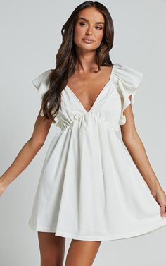 Raiza Mini Dress - Ruffle Sleeve Tie Back Plunge Dress in Off White Classy Graduation Outfit, White Grad Dress, Rush Week Outfits, After Wedding Dress, Bride Reception Dresses, Confirmation Dresses, White Dresses Graduation, Senior Stuff, Dresses Graduation