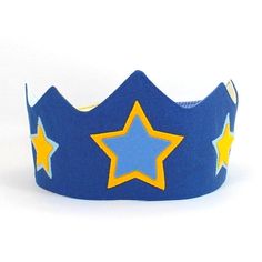 this sweet blue crown with stars is perfect for your little one! wonderful and funny accessory for any celebration. use it on birthday or party, at school, for a photo shoot, dress up for kindergarten or any time you want to feel special...safe and easy to use for little hands. my products are lovingly and ethically made by myself  ITEM DETAILS: >size: fits approximately sizes 2T-6T. closes with a generous 2 inches velcro closure to acommodate a range of sizes.   measures 5.5 inches tall at highest point and 23 inches long. >material: 100% cotton canvas, 100% wool felt, 100% cotton inner batting for structure and comfort.  interior made from colorful vintage cotton fabric mix >adjustable and reversible >wool felt applique is hand-stitched with great care >small changes on the design are fr Blue King Crown, Felt Crowns For Kids, Birthday Crown Boy, Felt Birthday Crown Boy, Felt Birthday Crown, Photo Shoot Dress, Prince Crown, Crown For Kids, Custom Crown