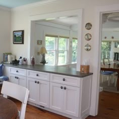 the kitchen is clean and ready to be used as a dining room or living room