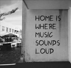 there is a sign that says home is where music sounds louds sound on the wall