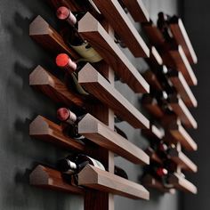 a wall mounted wine rack with several bottles on it's sides and two rows of shelves