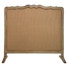 the headboard is made from wood and has a wicker design