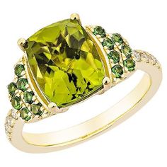 This collection features a selection of the most Olivia hue peridot gemstone. Uniquely designed this ring with tsavorite and diamonds in Yellow gold to present a rich and regal look. Peridot with Tsavorite and White Diamond Ring in 18 Karat Yellow Gold. Peridot: 3.67 carat, size: 10X8mm pear shape. Tsavorite: 0.28 carat, size: 1.60mm round shape. Diamonds: 0.11 carat, size: 1.50mm round shape G color, VS clarity. Gold: 4.748g, 18Karat yellow gold. R1684 Luxury Peridot Diamond Ring For Formal Occasions, Formal Peridot Diamond Ring In Yellow Gold, Green Diamond Ring With Gemstone Accents For May Birthstone, Green Peridot Diamond Ring With Accent Stones, Fine Jewelry Green Diamond Ring With Gemstone Accents, Yellow Gold Peridot Rings With Gemstone Accents, Green Diamond Ring With Accent Stones, Luxury Peridot Rings With Accent Stones, Luxury Yellow Gold Peridot Rings