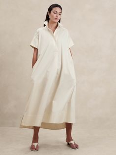 We reimagined the timeless kaftan silhouette with wide sleeves and slits at the side hem to show a little leg.  Here, we've cut this dress in our signature cotton poplin, woven with added stretch for comfort.  Relaxed fit with dropped shoulder.  Long, wide sleeves.  Deep v-neck with collar.  On-seam pockets.  Straight hem with high, side slits.  Unlined.  Relaxed fit.  Short sleeves.  Maxi length.  Model: Size S, 5'10" (178cm). Funky Dresses, Nature Dress, Comfy Dresses, Wide Sleeves, Bridal Outfits, Side Pocket, Deep V Neck, Cotton Poplin, Work Outfit