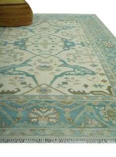 Expertly handcrafted with premium wool, this custom-made ivory and teal traditional Oriental Oushak rug features intricate hand-knotted designs for a timeless and luxurious addition to any space. Add warmth, elegance, and durability to your home with this one-of-a-kind piece. Hand-Knotted Made with Wool Made to Order in 30-45 Days Color: Ivory and Teal Made with 28 knots per square inch USERS GUIDE Avoid prolonged moisture Vacuum regularly and/or shake to remove dust Do not pull any loose threads. Use scissors to simply cut the ends The blot spills immediately with a white cloth. Harsh chemicals may damage or fade the rug Use rug protectors under heavy furniture Ivory Color Palette, Ivory Color, Traditional Design, Oushak Rug, Hand Knotted, Wool Rug, Wool, Color, Design