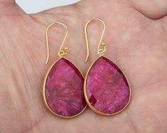 This pair of large ruby earrings would be a nice reward for yourself or a great gift for your mother or best friend. The pendant has an attractive ruby stone set in gold plated bezels: 1. Stone: ruby 2. Stone shape & size: pear shape 25 x 20 mm ; heart 20 x 20 mm 3. total length: pear 42 mm; heart 36 mm 4. bezel material: gold vermeil or sterling silver 5. earring hook: gold vermeil or sterling silver 6. an optional custom jewelry card printed with your own message, if you are sending these Handmade Ruby Teardrop Earrings, Red Pear-shaped Earrings For Gift, Pear-shaped Ruby Earrings For Gift, Ruby Earring, Oval Locket, Memory Locket, Earring Drop, July Birthday, Earring Hook