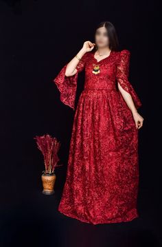 This stunning wine red Kurdish dress, featuring intricate floral embroidery and shimmering sequins, is the perfect choice for weddings, cultural events, and formal gatherings. The dress is designed with a flattering silhouette and detailed craftsmanship, showcasing the beauty of traditional Kurdish attire with a modern twist. The lace sleeves and delicate embellishments add an extra touch of elegance. *Material: Chiffon with sequins and floral embroidery *Size: Available in small size  *Care Ins Festive V-neck Gown For Eid, Party Wear Embroidered Dress For Reception, Embellished Maxi Dress For Party And Festivals, Festive Evening Maxi Dress With Resham Embroidery, Elegant Gown For Reception And Festivals, Red Embroidered Party Wear Dresses, Festive Resham Embroidery Evening Maxi Dress, Party Gown With Floral Embroidery And Lace, Party Evening Dress With Resham Embroidery