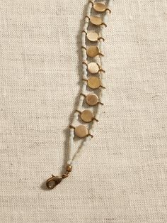 Saw this on Banana Republic: Brass Beaded Bracelets With Round Beads, Bohemian Beaded Brass Bracelets, Adjustable Brass Beaded Chain Jewelry, Hand-strung Cream Bohemian Jewelry, Jewelry Shapes, Boho Jewelry Bracelet, Tiny Bead Bracelet, Unique Beaded Jewelry, Bead Woven Bracelet