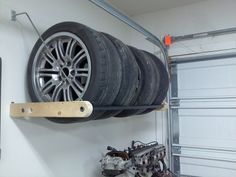 a car tire mounted to the side of a wall