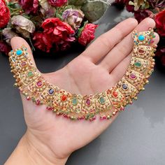 Featuring a navrattan necklace with chandbali earrings in 22ct gold. The necklace weighs 40.36 GMs including 4.83 GMs of hanging beads. The earrings 19.37 GMs including 2.13 GMs of hanging beads Price Breakup Summary Component Rupees % of Total 22k Gold 252,491 74.9% Stones & Beads 29,232 8.7% Making Charges 45,448 13.5% Taxes (GST) 9,815 3.0% Total 336,987 100.0% View Detailed Price Breakup Festive Multicolor 22k Gold Bridal Necklace, Multicolor Fusion Gold-plated Jewelry, Festive Gold Temple Necklace With Multi-stone, Traditional Multicolor 22k Gold Necklaces, Traditional Multicolor 22k Gold Necklace, Multicolor Gold Plated Fusion Jewelry, Multicolor 22k Gold Necklaces For Celebration, Multicolor Fusion Style Gold Plated Jewelry, Multicolor Fusion Gold Plated Jewelry