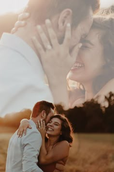 a man and woman are hugging in the field