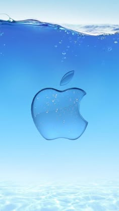 an apple logo floating in the water with blue sky and clouds behind it, as seen from below