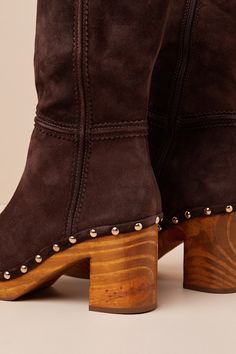 The Matisse Village Chocolate Suede Leather Platform Mid-Calf Boots are ready to be paired with falling leaves and a PSL! These too-cute boots have a genuine suede leather construction that shapes a rounded-toe upper atop a 1"" toe platform that boasts gold studded accents. The 10"" mid-calf shaft features seam detailing and a 13.25"" circumference. A 10.5"" zipper and gusset detail at the instep allow for easier styling, while a wood block heel completes the Boho-style look! Available in whole Cute Boots, Falling Leaves, Calf Boots, Heel Boots, Mid Calf Boots, High Heel Boots, Mid Calf, Boho Style, Suede Leather