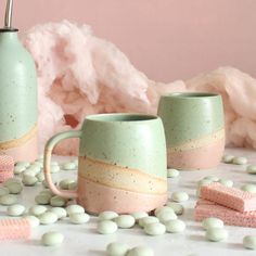 Handmade in the UK, this Cotton Candy inspired pastel green and pink mug is perfect for coffee, tea or hot chocolate. The colourful mug design with contrasting rustic clay makes this a special addition to any kitcheware collection - and why not make your own mug set from the variety of other pastel colours we offer? We love the gorgeous combination of our unique pale pink and mint green glazes, seperated by the exposed flecked stoneware with its rich orange-toned burn created by the kiln-firing. Pastel Green And Pink, Make Your Own Mug, Mint Green Flowers, Pink Mug, Pink And Mint, Green Mugs, Painted Mugs, Rose Pastel, Ceramics Ideas Pottery