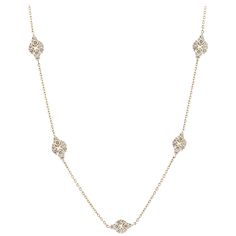 18K yellow gold chain style necklace with diamond stations. The stations are in a diamond shape with each station containing eight round diamonds. The 168 round diamonds total 5.90 carats, G-H color and VS1-VS2 clarity. The necklace measures 43 inches in length. Marked "750" on the clasp. Chain With Diamonds, Gold Long Chain, Diamond Chain Necklace, Necklace With Diamond, Hamsa Pendant, 18k Gold Chain, Diamond Solitaire Necklace, Long Chain Necklace, White Gold Necklaces