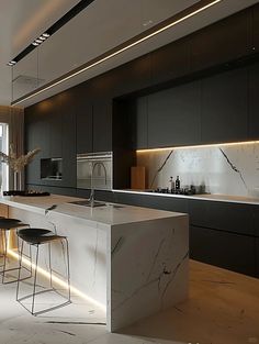 a modern kitchen with marble counter tops and stools