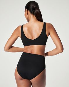 Designed with a beautiful textured fabric, this shaping high rise bottom was created to flatter every body. Featuring a unique design with flexible layers and no-dig leg openings, this style is equally as chic as it is sun and swim-friendly. | Spanx Women's SPANXshape Swim Pique Hi-Rise Cheeky Bottom High Rise Seamless Bottoms, Modern Fitted High-cut Leg Bottoms, Modern Fitted High-waist Swimwear, Chic Seamless High Waist Bottoms, Chic Seamless High-waist Bottoms, Chic High Waist Seamless Bottoms, High Waist Sculpting Bottoms With Seamless Construction, High-waist Sculpting Bottoms With Seamless Construction, High Waist Sculpting Seamless Bottoms