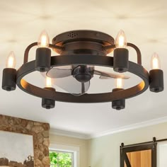 a ceiling light with five lights on it in a living room or dining room area