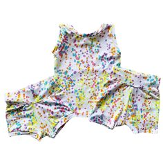 These white shorts with neon dots are SO much fun, so soft and oh so cute. Grab a matching tank top HERE Choose between the two styles- "Shorties" or "Longer Shorts". See the below descriptions for the difference between them. Shorts have a separate waistband and are a mid-length. They end just above or around the knee, depending on the child's height. Shorties have a separate waistband, and tiny cuffs at the bottom of the leg section. They are not slim fit, but not loose either. They end mid thigh to show some of that cute baby thigh we all adore. Playful Green Summer Shorts, Fun Green Summer Shorts, Multicolor Playful Shorts For Playwear, Fun Stretch Shorts For Spring, White Shorts For Spring Playwear, White Shorts For Playwear In Spring, White Summer Playwear Shorts, Playful Yellow Summer Shorts, Playful Shorts For Spring Playtime