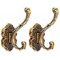 pair of ornate brass door handles on white background