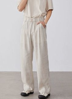 Embrace relaxed sophistication with our Linen High-Waisted Wide-Leg Trousers, perfect for any casual or smart-casual rendezvous.
Expertly tailored from a refreshing blend of linen and cotton, these trousers offer a breathable and comfortable fit, ideal for warmer days. A practical, elastic waist ensures a snug fit, while the loose straight cut and solid color design lend a touch of nonchalant elegance.
Pair them with a fitted tee or button-up shirt for a smart look, or throw on an oversized swea Straight Fit Trousers, Fitted Tee, Weekend Style, Fitted Trousers, Oversized Sweater, Straight Cut, Wide Leg Trousers, Workout Tee, Smart Casual