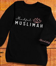 A t-shirt designed for conscious Muslim women. A garment that embodies sophistication and mindfulness, designed with the devout Muslim woman in mind. Demonstrate your mindfulness with this Muslimah T-Shirt. Inspirational Black Relaxed Fit T-shirt, Black Relaxed Fit T-shirt As Gift, Inspirational Black Cotton T-shirt, Black Inspirational Crew Neck T-shirt, Inspirational Black Crew Neck T-shirt, Inspirational Black T-shirt With Screen Print, Black T-shirt With Name Print For Gift, Gift Black T-shirt With Name Print, Unisex Black T-shirt For Gift