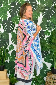 Vasilia is a statement piece! This stunning kimono has a fun mix of colors and three different patterns throughout. It features tacked arm holes and side slits. This flowy, silky kimono will keep you cool and looking cute while layered over your fave basics! One Size Open Front Tacked Arm Holes Side Slits 100% Polyester Length Bust 38" 80" Spring Multicolor Kimono With Vibrant Print, Summer Kimono With Vibrant Patterned Print, Bohemian Patterned Kimono With Vibrant Print, Multicolor V-neck Kimono With Floral Print, Multicolor Floral Print V-neck Kimono, Keep Your Cool, Front Open, Different Patterns, Statement Pieces