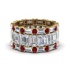 The emerald cut eternity band with matching baguette and round bands showcases excellent quality emerald cut diamonds vertically placed in one band whereas, a sparkling sequence of horizontally set baguette diamonds and round cut diamonds in other two bands brings in a captivating effect. The emerald cut diamond eternity band is incarcerated with a pristine series of horizontally placed emerald cut diamonds of 4.20 carat total weight, VS2 clarity and H color in prong setting. Alternate sequence of round cut diamonds of 0.72 carat total weight, SI2 clarity, G color and baguette diamonds of 1.68 carat total weight, VS2 clarity and G color beautifies the other two bands in prong setting. Total number of diamonds - 69. Total carat weight – 6.60 CTW. This trio wedding bands can also be ac Wedding Bands Stacked, Emerald Cut Diamond Eternity Band, Emerald Cut Eternity Band, Wedding Rings Emerald Cut, Blue Wedding Rings, Ruby Wedding Band, Ruby Wedding Rings, Stacked Wedding Bands, Gold Flower Ring