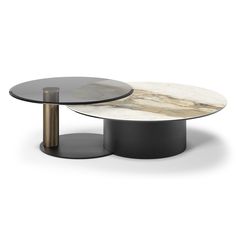 two tables with marble top and metal base, one is black and the other is white