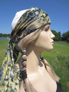 "VACATIONHOUSE HATS Skullcap Beanie Hat with Long Drape scarf that can be double wrapped around head and tied for a turban look.. Light weight Cotton knit Navy blue Or Ivory Cap with Beautiful printed scarf attached to skull cap Style hat. More photos of other color here... https://www.etsy.com/shop/Vacationhouse/search?search_query=A1658&order=date_desc&view_type=gallery&ref=shop_search Quality yarns Quality knits GREAT GIFTS! Measurements: Length 7.5\" Measurement around Rib 17\" 2 Bohemian Spring Headwrap, One Size Fits Most, Adjustable Bohemian Bandana For Spring, Bohemian Beanie Headwrap, Casual Adjustable Headscarf For Festivals, Bohemian Adjustable Headwrap For Spring, Spring Adjustable Headwrap, Bohemian Winter Headwrap One Size, Adjustable White Bohemian Headscarf, Bohemian One Size Winter Headwrap