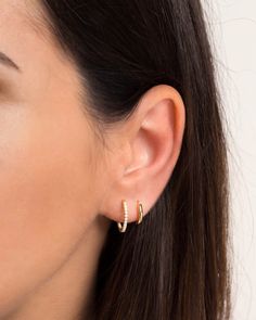 "A must-have essential in every jewelry collection - these dainty, medium-sized hoops are embedded with sparkly cubic zirconia gemstones and will go with everything. ∙ Sold individually (1 earring) or as a PAIR (2 earrings) * D E T A I L S * ∙ Material: .925 Sterling Silver or 18K Gold Plated over .925 Sterling Silver ∙ Stone: White Zirconia ∙ Dimensions:  Diameter: 15mm ∙ Hypoallergenic & nickel-free * P A C K A G I N G * ∙ All jewelry is sent out beautifully packaged in our signature box & ready for gifting. ∙ In order to reduce waste, we often put an order with multiple pieces in the same box. If one of the pieces is intended as a gift or if you would like each piece in its own box, just leave a note at checkout and we'll be happy to box separately. ∙ No Extra Shipping Cost for addition Hoop Earrings Big, Earrings Small Hoop, Double Earrings, Small Gold Hoop Earrings, Earrings Gold Hoop, Dainty Hoop Earrings, Small Gold Hoops, Tiny Hoop Earrings, Hoops Gold