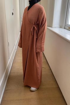 100% certified organic muslin. Wrap-around prayer dress. One-of-a-kind. Easy to wear. Comfortable. Oversized fit. XS-M : Height of dress: 132 cm (ankle-length) L-XL : Height of dress: 140 cm (ankle-length ------------------------------------------------------------------- WHOLESALE: info.tiyoshop@gmail.com / +90 532 771 4513 Our luxurious minimalist abaya dresses are designed to have a baggy, loose-fitting yet flattering fit to ensure full comfort during prayer. We use natural, breathable materials to ensure the dresses feel airy and cooling.  With luxe materials, quality craftsmanship, and careful design, we guarantee these will become a beloved part of your daily practice. Like all our other items, these are hand made, with love. *Due to the quality of materials and the minimal design, t Abaya Dresses, Prayer Dress, Muslin Cloth, Dress Abaya, Head Coverings, Muslim Prayer, Prayer Mat, Dress Simple, Islamic Clothing