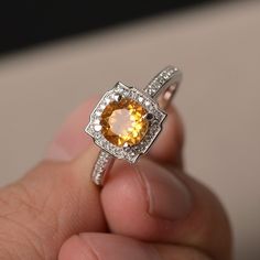 This is a gorgeous handmade creation. Its beauty is its simplicity & Elegance. The 7*7mm round cut natural citrine is crafted in solid sterling silver and with rhodium plated. It is available to customized, if you have any mind, just let me know, we will discuss with it. All item is sent in a beautiful gift box You can realize more lovely stuff clicking the link https://www.etsy.com/shop/knightjewelry?refshopsection_shophome_leftnav Please leave the correct address and you PHONE NUMBER for d White Gold Citrine Birthstone Ring With Gemstone, White Gold Citrine Topaz Ring With Center Stone, White Gold Topaz Ring With Citrine, Citrine Rings With Accent Stones, Topaz Citrine Ring With Center Stone, Yellow Sapphire Topaz Ring With Accent Stones, Topaz Ring With Yellow Sapphire And Accent Stones, Round Topaz Ring With Citrine Center Stone, Yellow Topaz Crystal Ring