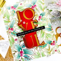 a close up of a greeting card with scissors and other items in the foreground