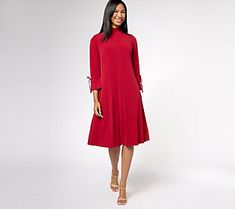 Want serious sophistication? This mock-neck midi dress has you covered -- plus a side of sass from flouncy sleeve cuffs and tie details. Make it your style staple for everything from brunches to boardrooms. From Susan Graver. Chic Bell Sleeve Midi Dress For Fall, Formal Fall Midi Dress With Bell Sleeves, Formal Midi Dress With Bell Sleeves For Fall, Spring Solid Color Dress With Bell Sleeves, Spring Solid Color Bell Sleeve Dress, Solid Bell Sleeve Dresses For Spring, Fall Bell Sleeve Dresses For Workwear, Fall Workwear Midi Dress With Bell Sleeves, Susan Graver