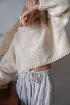 "Cute chunky crop sweater with long balloon sleeves. Made from organic undyed pure wool. Materials: wool Measurements of size S/M: Length: 40 cm (+ 5cm neck) Chest: 130 cm Measurements of size L/XL Length: 45 cm (+5 cm neck) Chest: 147 cm Measures of Model in the photo Size: S Chest: 33\" - 83 cm Waist: 24\" - 62 сm Hip: 35\" - 88 cm Height: 5′ 6″ CARE INSTRUCTIONS: DRY CLEAN is the best way. HAND WASH. Make sure to use cold water and neutral soap. The less you touch and agitate them, the better Cozy Oversized Cropped Sweater, Cozy Cropped Chunky Knit Sweater, How To Wear Cropped Sweaters, Cropped Wool Sweater, Crop Pullover, Boxy Sweater, Wool Jumper, Wool Clothing, Chunky Wool