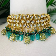 We bring beautiful Jewelry sure to elevate any look! Kindly pay attention to all photos and video and ask questions about the item prior to ordering. Party Kundan Choker With Tilla Details, Party Kundan Chandbali Necklace With Tilla, Kundan Necklace With Gota Work For Festivals And Parties, Kundan Necklace With Stone Work For Party And Festivals, Bollywood Kundan Necklace For Parties And Festivals, Bollywood Style Kundan Necklace For Party, Traditional Kundan Necklace For Party, Heavy Kundan Tikka For Parties, Bollywood Style Kundan Necklace With Tilla For Parties