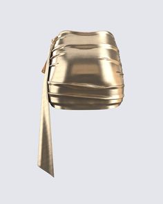 This golden drape skirt is your key to instant glam ✨ Made from lame jersey fabric, and complete with an asymmetrical hem, sash detail, ruching detail, and an elastic waistband - this skirt has a luminous allure perfect for stealing the spotlight anywhere you go 😌 Elegant Party Bottoms With Ruched Sides, Chic Ruched Party Skirt, Chic Draped Wrap Skirt For Party, Chic Ruched Skirt For Party, Party Draped Skirt With Ruched Detail, Party Skirt With Ruched Draped Design, Draped Fitted Mini Skirt For Party, Party Draped Fitted Mini Skirt, Chic Metallic Mini Skirt For Evening