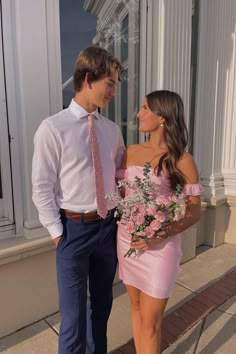 Hoco Pink Couple, Pink Satin One Shoulder Mini Dress, Pink Hoco Couple Outfits, Homecoming Pic Ideas Couple, Pink Satin Mini Dress For Formal Occasions, Pink Satin Mini Dress For Prom, Pink Satin Strapless Dress For Spring, Spring Pink Satin Strapless Dress, Pink Satin Strapless Dress For Date Night