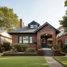 a brick house with steps leading to the front door