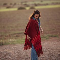 "Luxury shawl made in macana, an artisan fabric handmade in Ecuador (Ikat technique). 100% cotton - 70% organic pigments. The \"Macana\" is an artisan fabric handmade on waist looms with organic cotton. The ancestral technique called \"Ikat\" has been transmitted for generations in the Andes of southern Ecuador. The tints used to dye the fabrics are of natural origin (plants, fruits and vegetables). Yakina wants to revalue and perpetuate this centuries-old tradition, thanks to fair trade with the network of artisans from the Gualaceo region (Ecuador)." Bohemian Shawl Scarf With Natural Dye, Bohemian Shawl Scarves With Natural Dye, Traditional Red Shawl Poncho, Red Bohemian Ikat Print Dupatta, Bohemian Handwoven Pashmina Shawl, Red Bohemian Dupatta With Ikat Print, Red Bohemian Pashmina Shawl, Bohemian Red Pashmina Scarf, Red Bohemian Pashmina Scarves